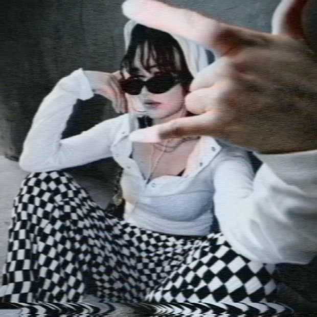 The checked pattern after the chain: chroma smears along the line and breaks up across the weave